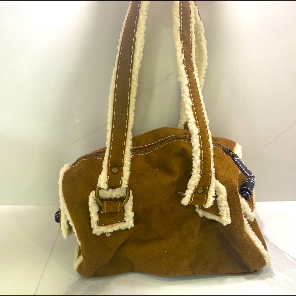 Fur bag.Perfect to match with your Ugg’s in winter